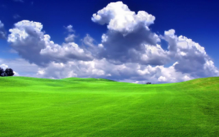 Над зеленым полем облака